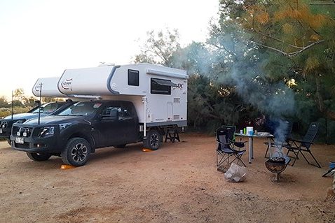 Ozcape Slide-On Motorhome, two Ozcape rigs and smoking campfire