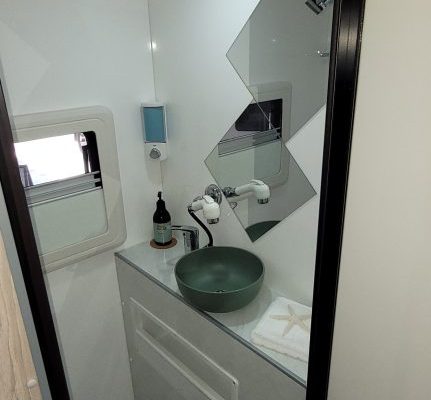 Bathroom of Ozcape Slide-On with shower, toilet and vanity