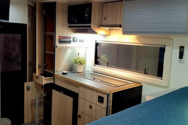 open cupboards and wardrobe in Ozcape Woondabaa truck camper