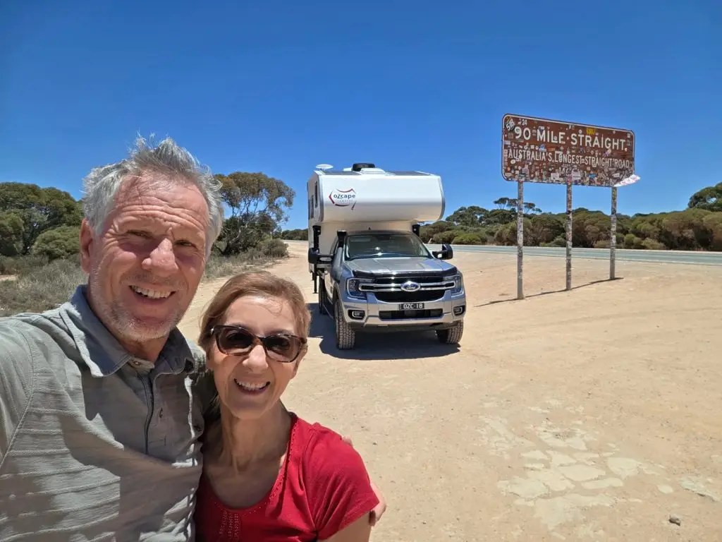 Happy couple at the start of the Nullarbor crossing in their Ozcape Slide-On