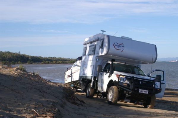 Ozcape Optima Slide-On on Mazda BT50 towing a boat on the beach.