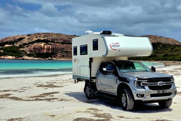 Ozcape-Slide On-Woondabaa Ozcape Slide On motorhome on beach with turquoise water