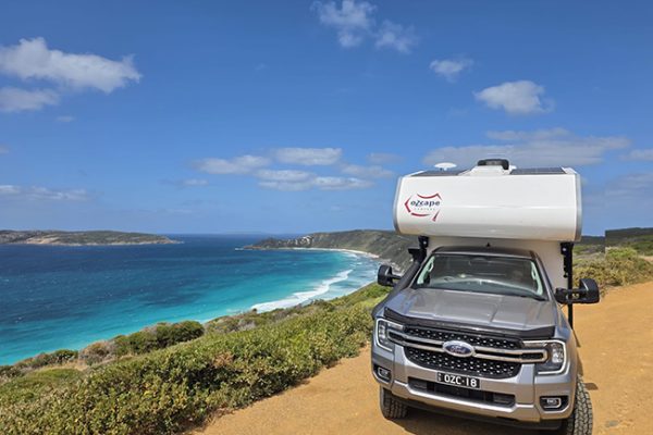 Ozcape-Woondabaa-Ford Ranger SuperCab Ozcape Campers Slide-On parked above stunning bay with turquoise waters. Exploring the most beautiful destinations.